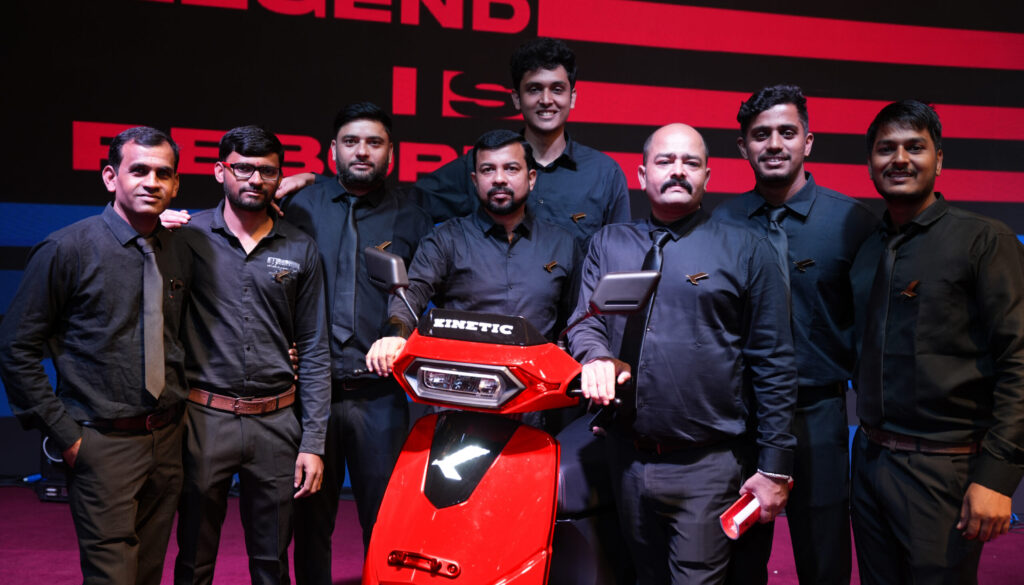 Kinetic employees with the new Kinetic DX EV electric scooter