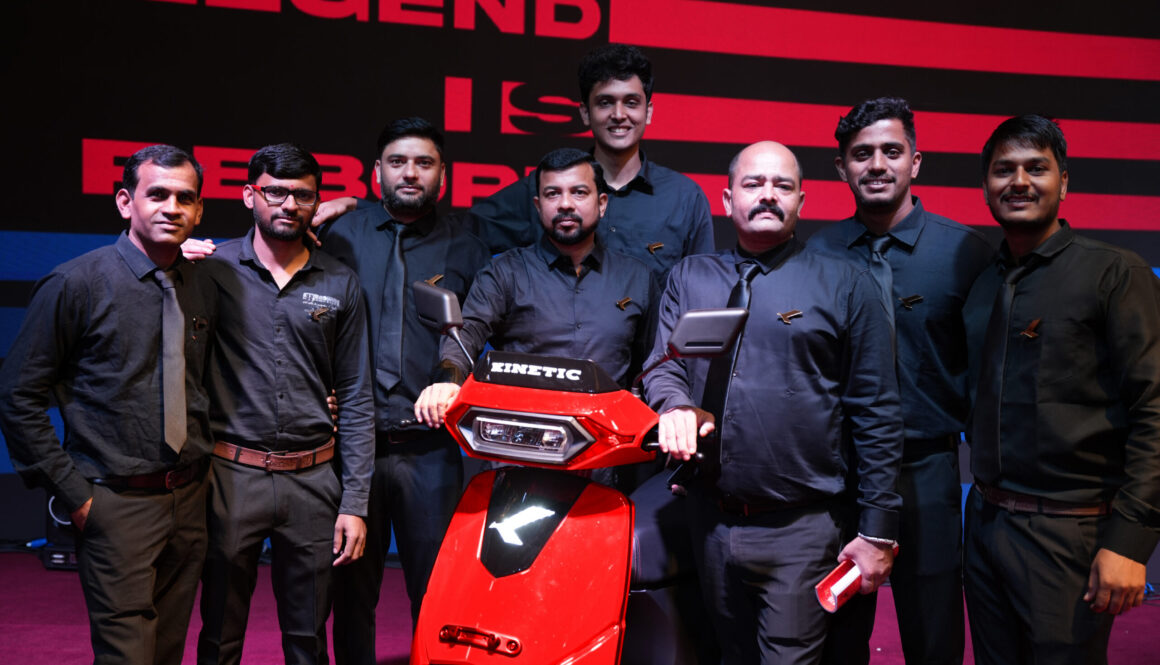 Kinetic employees with the new Kinetic DX EV electric scooter