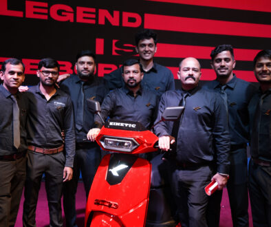 Kinetic employees with the new Kinetic DX EV electric scooter