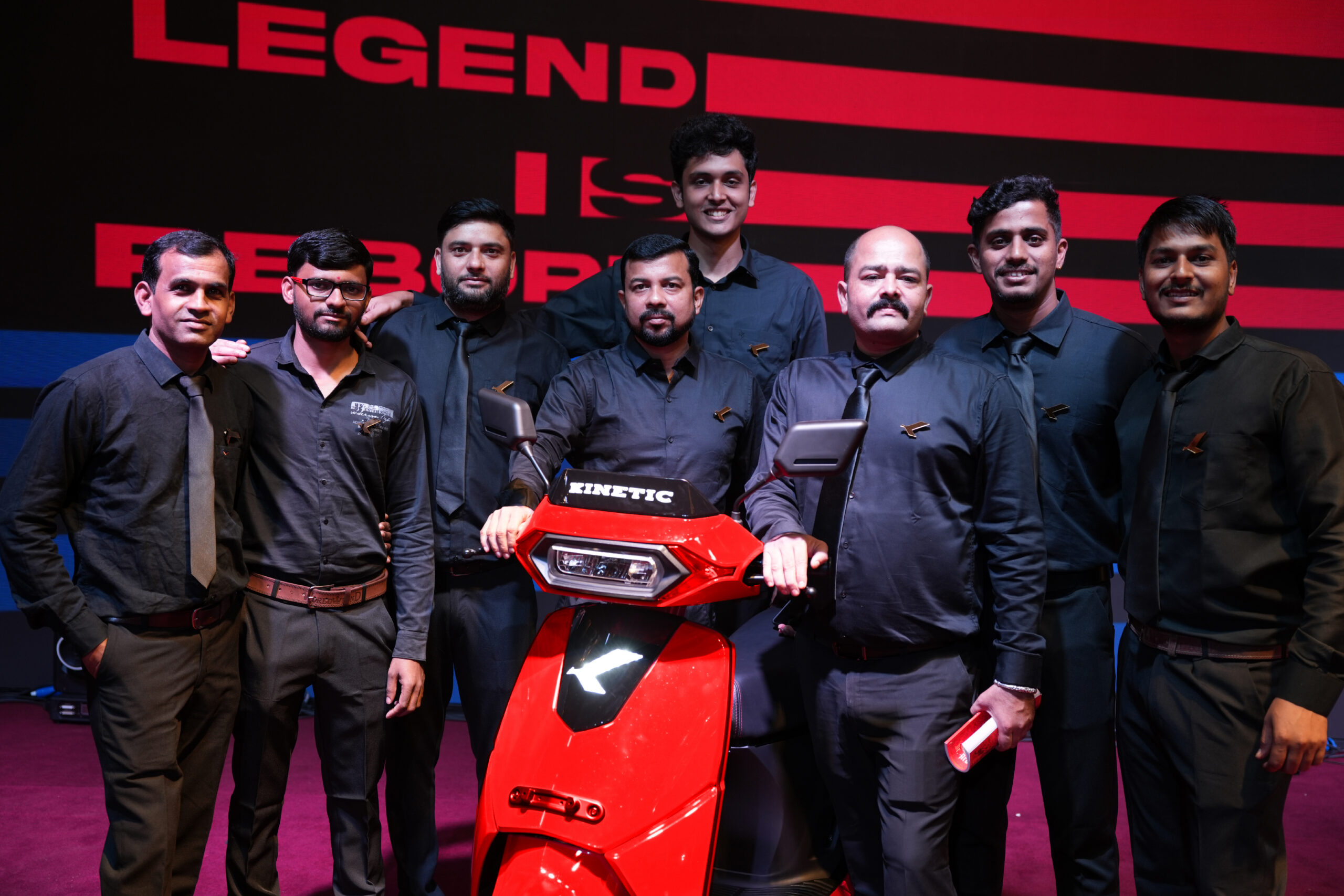 Kinetic employees with the new Kinetic DX EV electric scooter