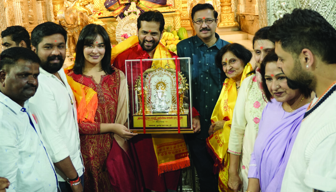 First Kinetic DX electric scooter receiving blessings at Shrimant Dagdusheth Ganpati Temple in Pune