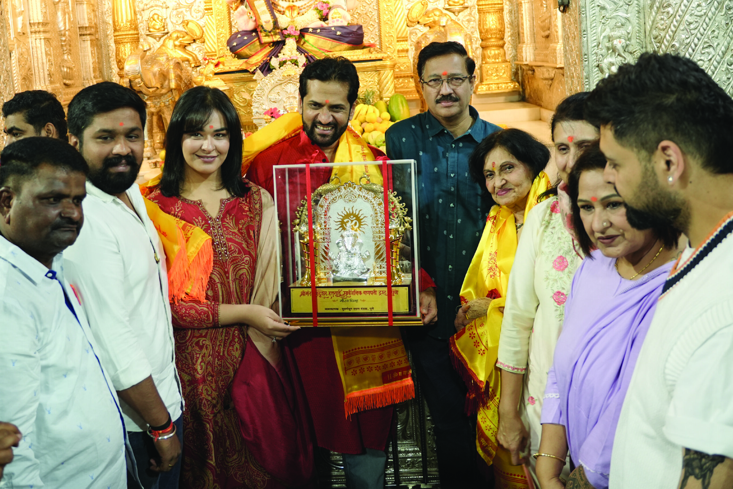 First Kinetic DX electric scooter receiving blessings at Shrimant Dagdusheth Ganpati Temple in Pune