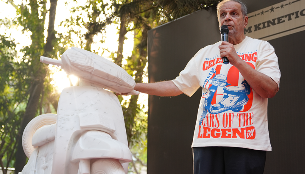 Dr Arun Firodia speaking at event promoting women empowerment with Kinetic scooter