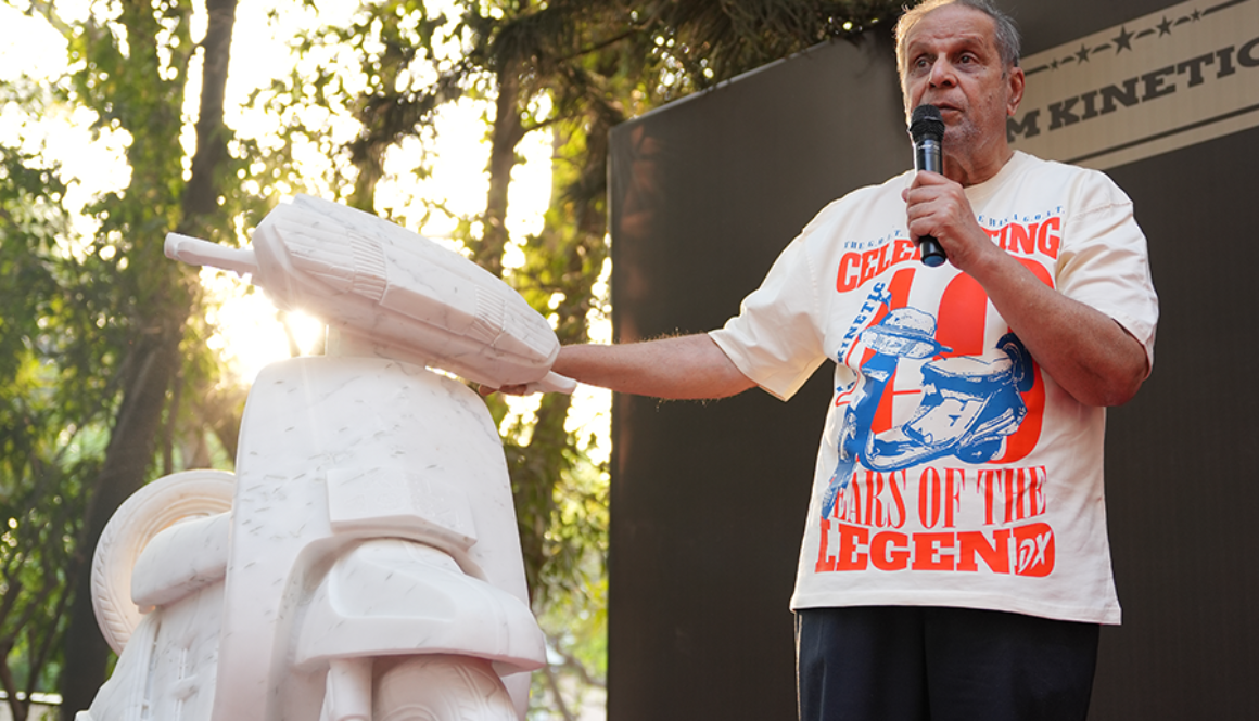 Dr Arun Firodia speaking at event promoting women empowerment with Kinetic scooter