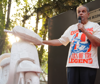 Dr Arun Firodia speaking at event promoting women empowerment with Kinetic scooter