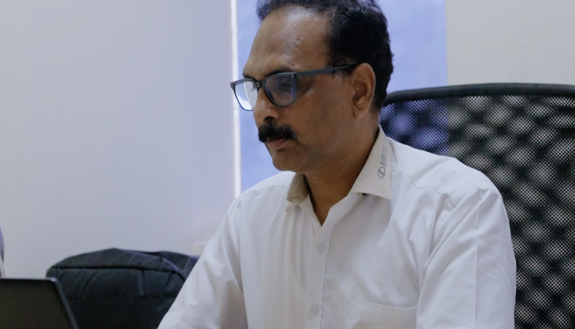 Vivek Pande working at desk during interview on engineering growth and leadership