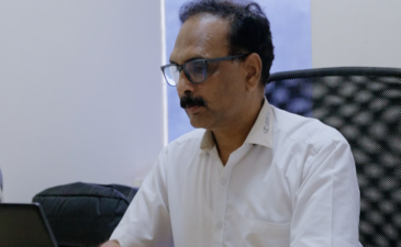 Vivek Pande working at desk during interview on engineering growth and leadership