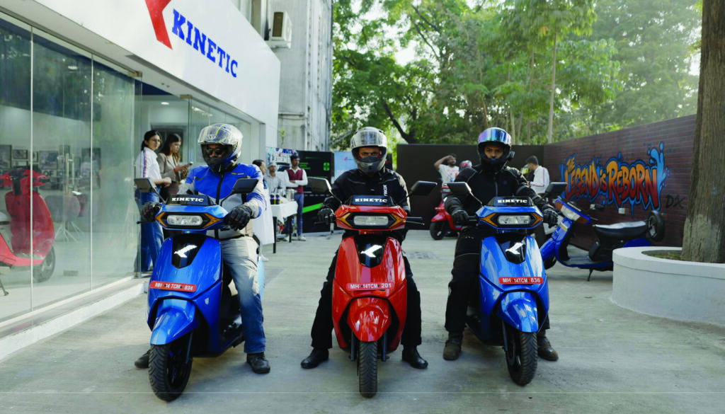 Journalists riding Kinetic DX+ electric scooters during Kinetic EV media ride event in Pune