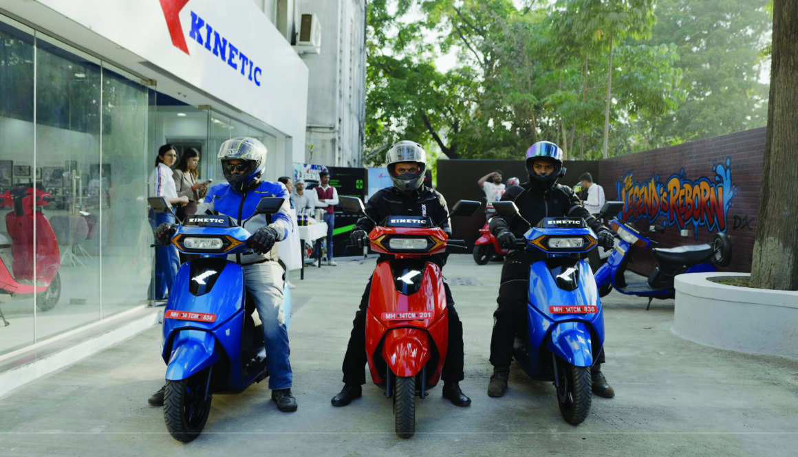 Journalists riding Kinetic DX+ electric scooters during Kinetic EV media ride event in Pune