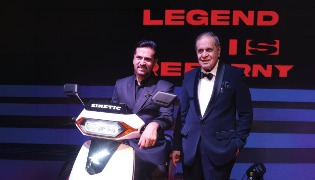 Dr. Arun Firodia and Ajinkya Firodia with the Kinetic DX EV, celebrating the legacy of innovation and the future of electric mobility in India.