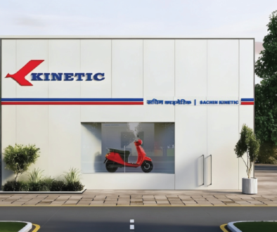 Kinetic EV dealership celebrating 100 vehicle deliveries at Surat and Pune, showcasing electric scooter showroom and sustainable mobility in India.
