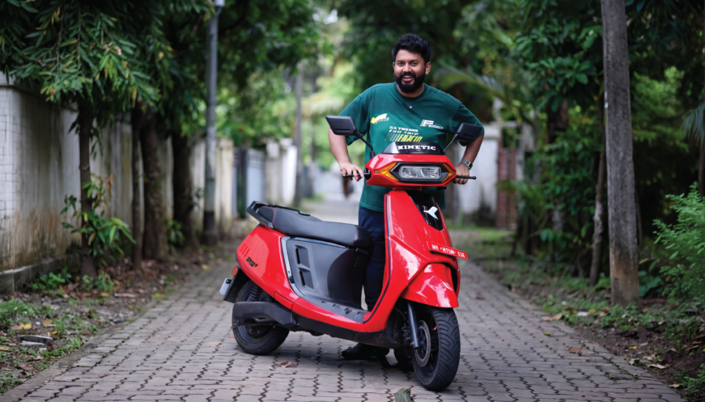 Journalist experiencing a Kinetic EV electric scooter during the exclusive media ride event in Kochi, showcasing smart, sustainable urban mobility.