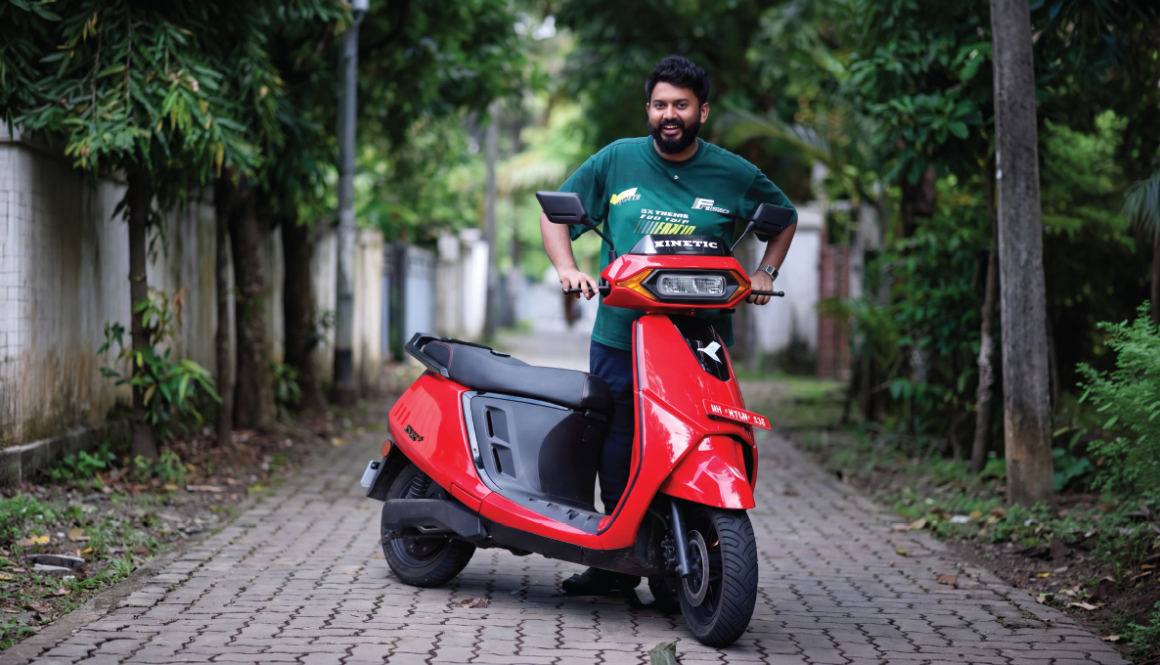 Journalist experiencing a Kinetic EV electric scooter during the exclusive media ride event in Kochi, showcasing smart, sustainable urban mobility.