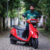 Journalist experiencing a Kinetic EV electric scooter during the exclusive media ride event in Kochi, showcasing smart, sustainable urban mobility.