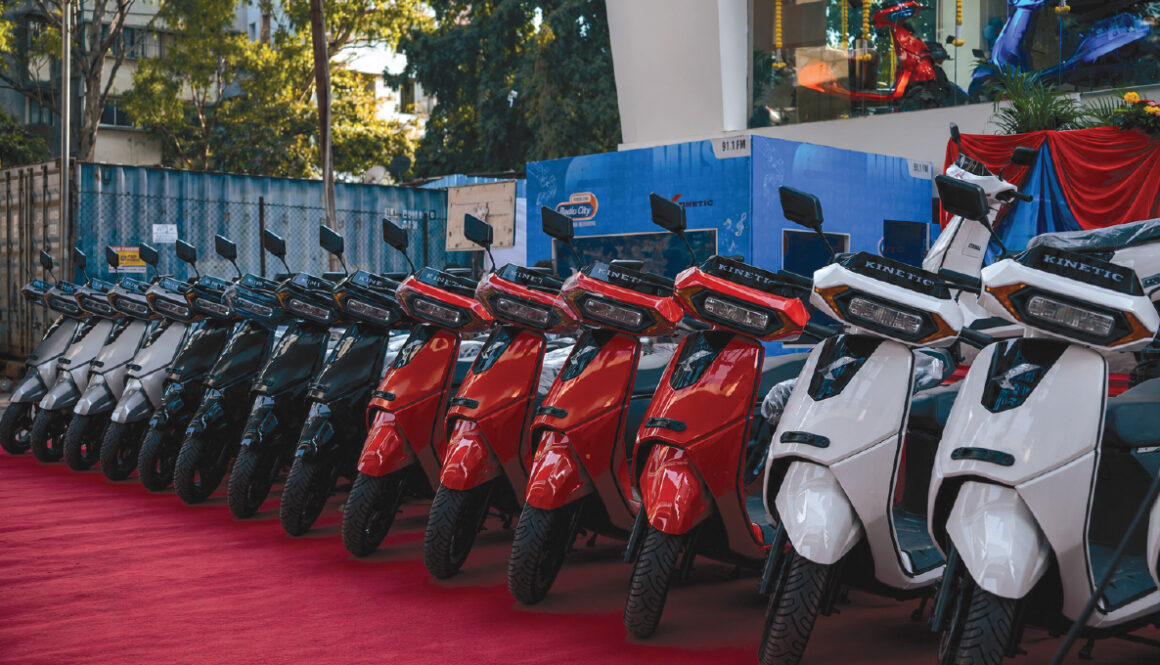 Kinetic electric scooters displayed at a showroom during nationwide dealership expansion