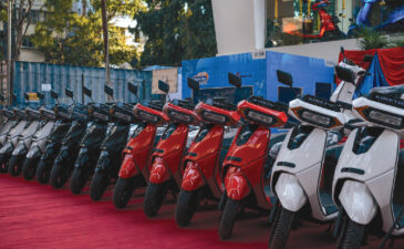 Kinetic electric scooters displayed at a showroom during nationwide dealership expansion
