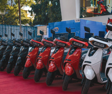 Kinetic electric scooters displayed at a showroom during nationwide dealership expansion